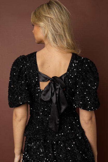 Top met Pailletten en Strikdetail